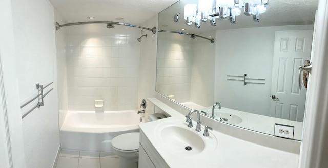 full bathroom featuring vanity, tiled shower / bath combo, tile patterned floors, and toilet