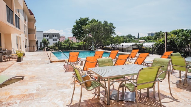 view of swimming pool featuring a patio