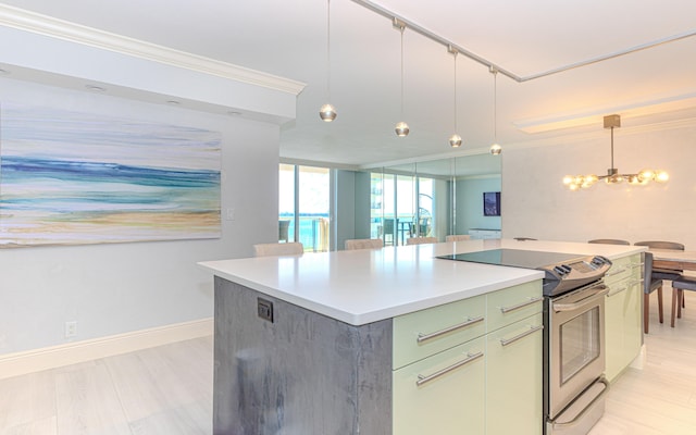 kitchen with hanging light fixtures, crown molding, a center island, and electric range