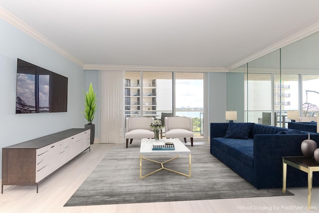 living room featuring ornamental molding, a water view, light hardwood / wood-style floors, and expansive windows