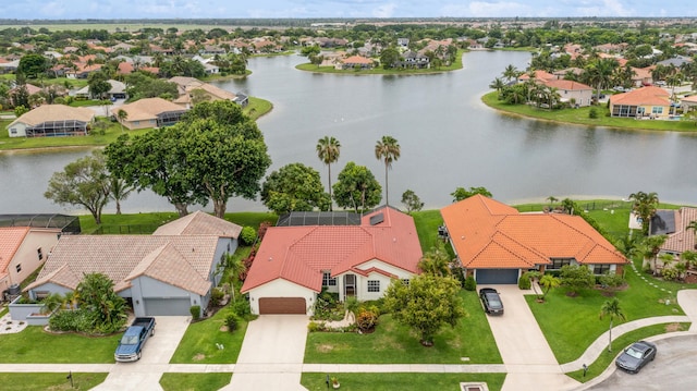 birds eye view of property with a water view