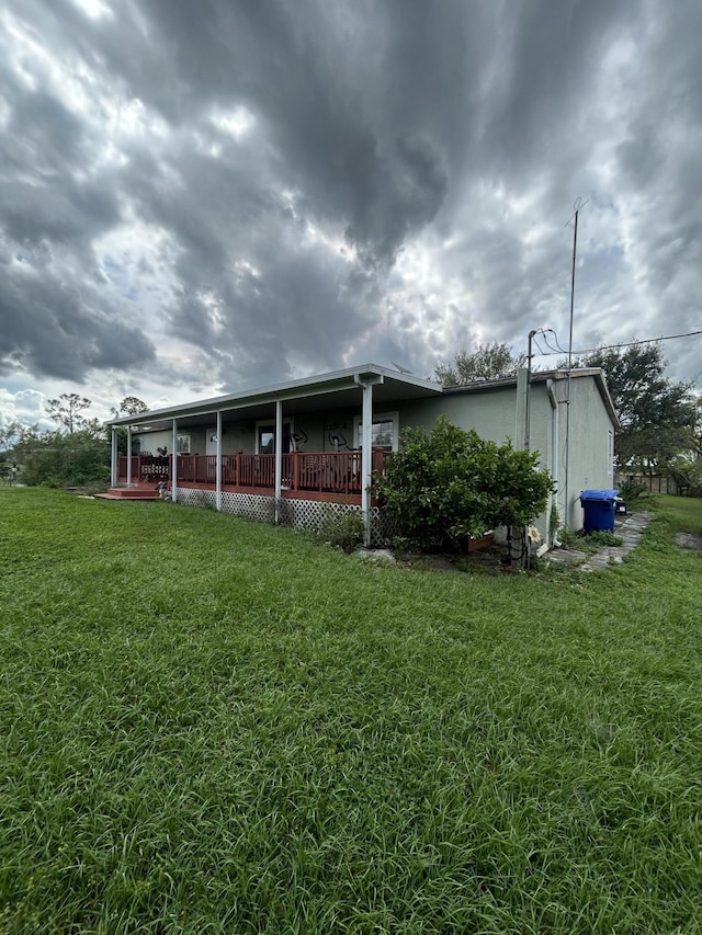 back of property featuring covered porch