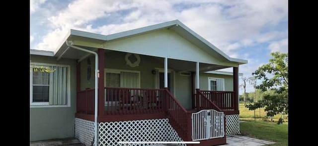 back of house with a porch