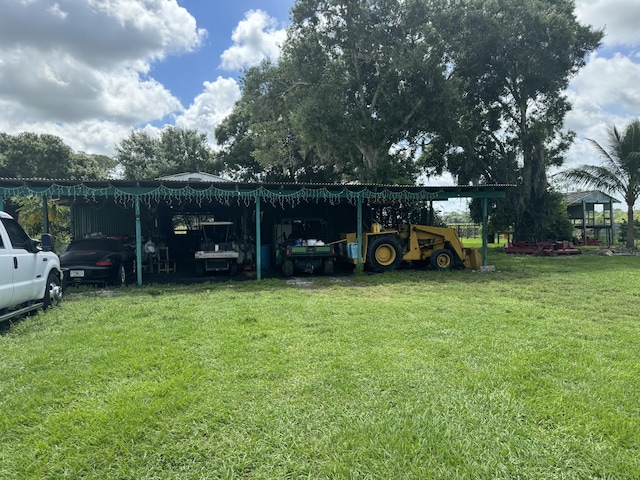 view of yard with a carport