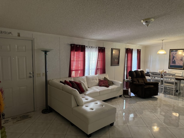 tiled living room featuring a textured ceiling