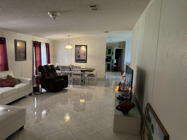 tiled living room with a textured ceiling