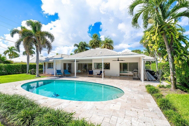 view of pool with ceiling fan and a patio area