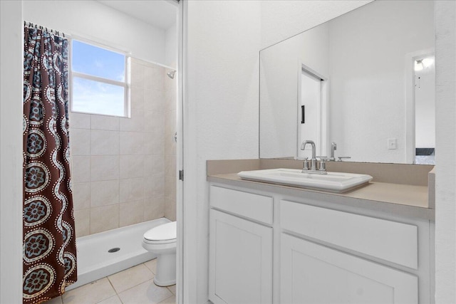 bathroom with vanity, a shower with curtain, toilet, and tile patterned floors