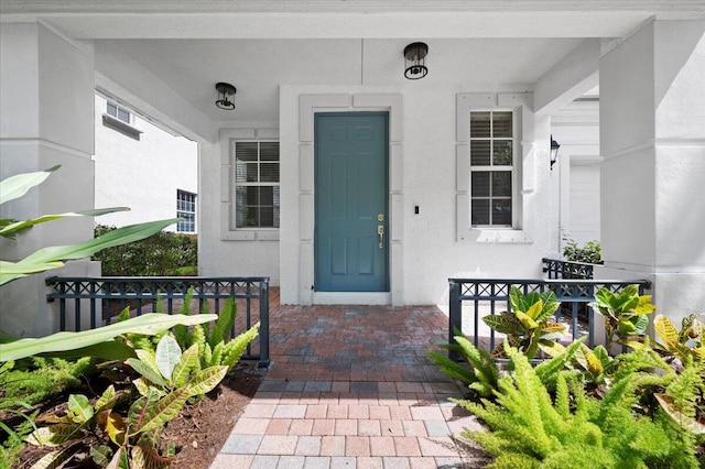 doorway to property with a porch