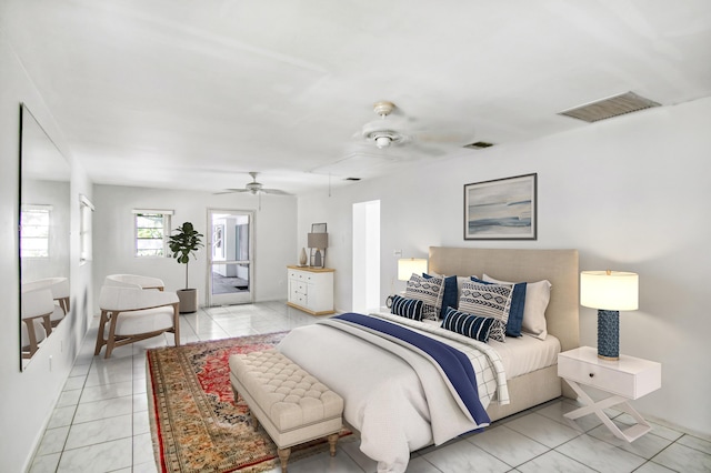 bedroom with access to outside, light tile patterned floors, and ceiling fan