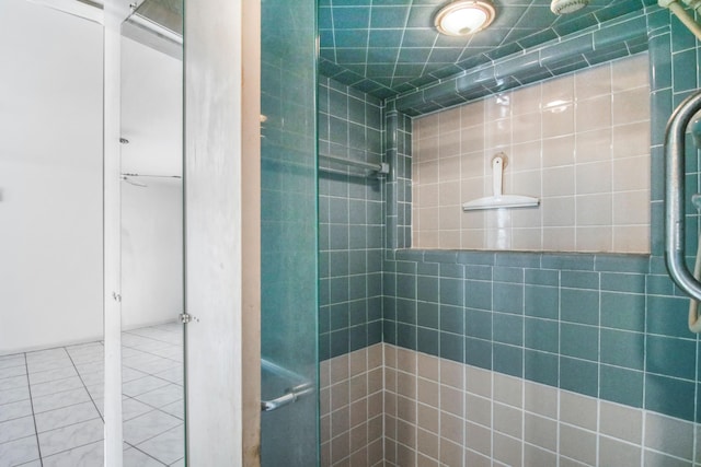 bathroom with tile patterned floors and walk in shower