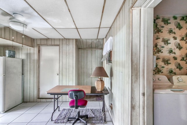 office with light tile patterned flooring and washing machine and clothes dryer