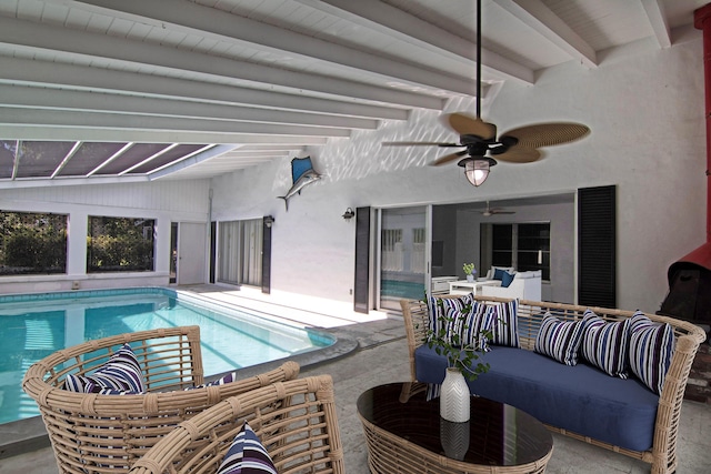 view of swimming pool with ceiling fan, an outdoor hangout area, and a patio