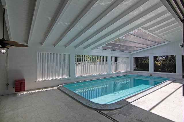 view of pool with a lanai, ceiling fan, and a patio area