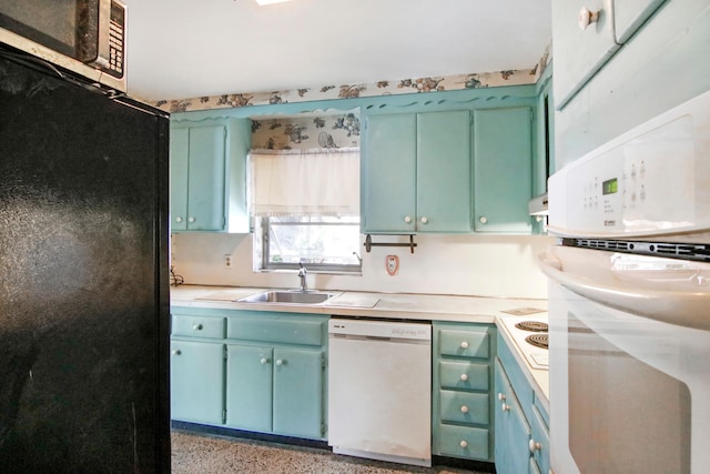 kitchen with sink and white appliances