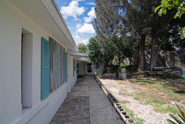 view of yard featuring a patio and a trampoline