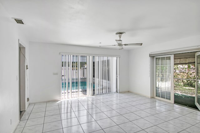 unfurnished room with light tile patterned flooring and ceiling fan