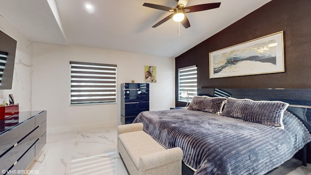 bedroom with multiple windows, lofted ceiling, and ceiling fan