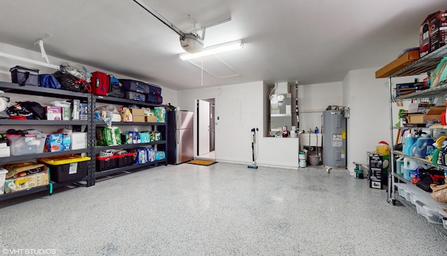 garage with water heater, heating unit, stainless steel fridge, and sink