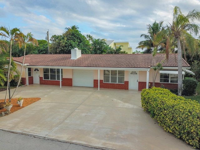 ranch-style house featuring a garage