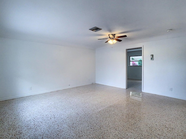 spare room with ceiling fan