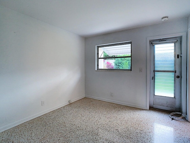 unfurnished room featuring a healthy amount of sunlight