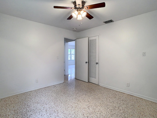 spare room featuring ceiling fan