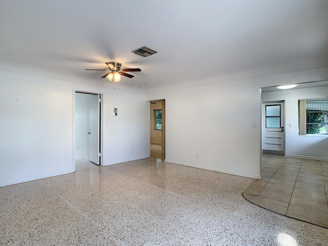 spare room with ceiling fan