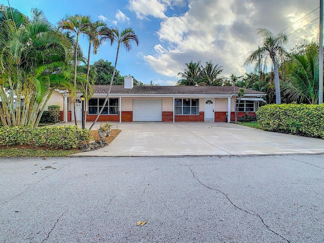 ranch-style home featuring a garage