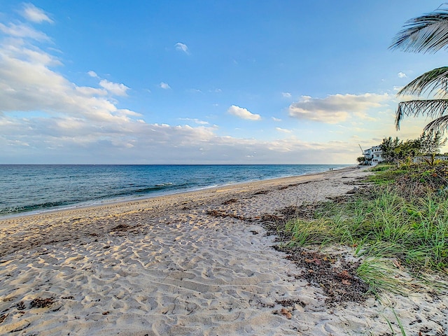 view of water feature with a beach view