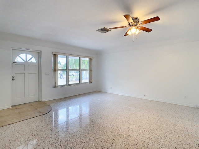 foyer entrance with ceiling fan and plenty of natural light