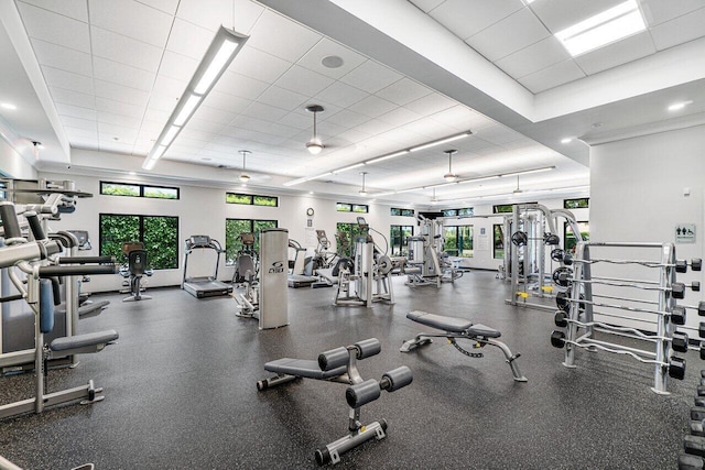 exercise room featuring a drop ceiling and plenty of natural light