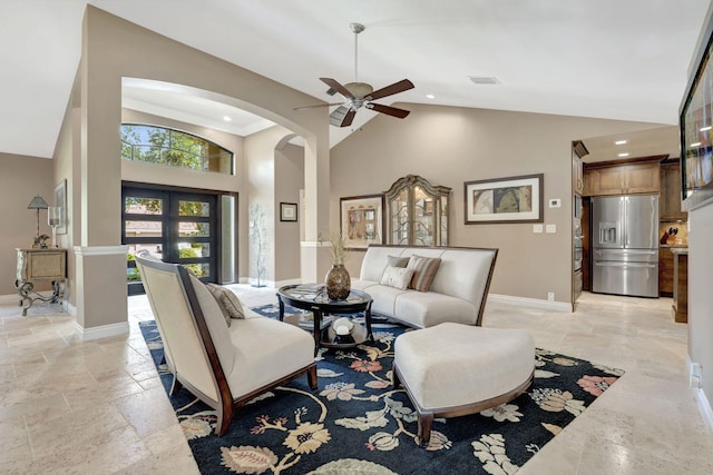 living room featuring high vaulted ceiling, ceiling fan, and french doors