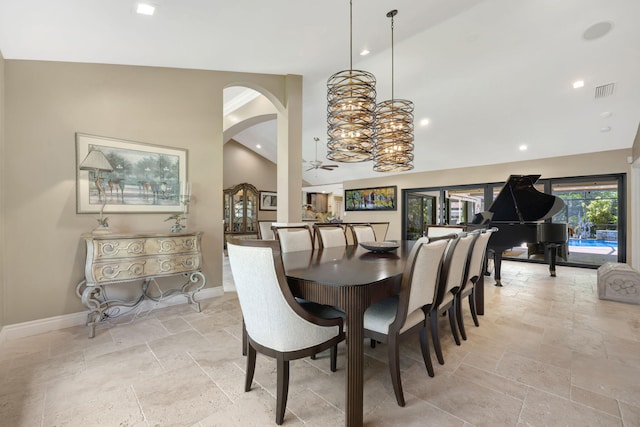 dining area featuring lofted ceiling and ceiling fan