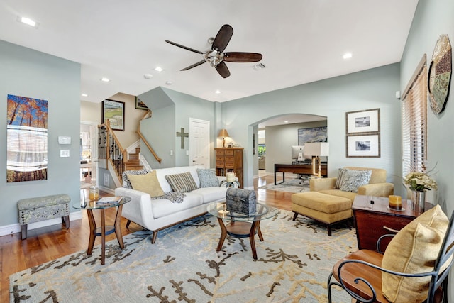 living room with plenty of natural light, ceiling fan, and hardwood / wood-style flooring