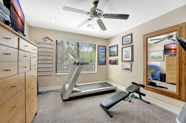 workout room featuring ceiling fan and light carpet