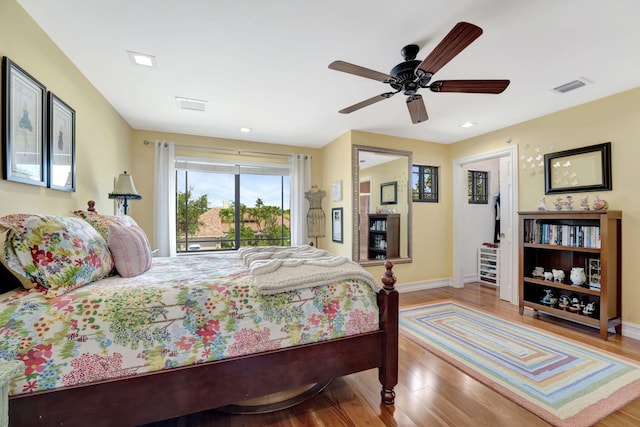 bedroom featuring access to outside, ceiling fan, and light hardwood / wood-style flooring