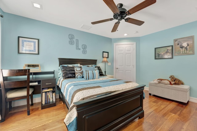 bedroom with ceiling fan and light hardwood / wood-style floors