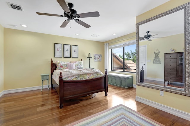 bedroom featuring light hardwood / wood-style floors and ceiling fan