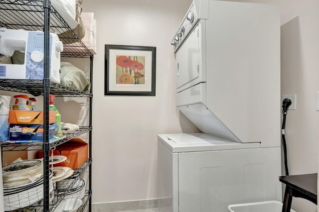 washroom with stacked washer and clothes dryer