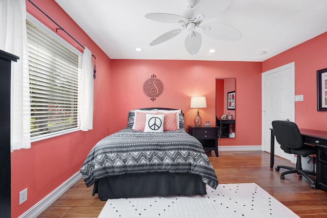 bedroom featuring ceiling fan and hardwood / wood-style floors