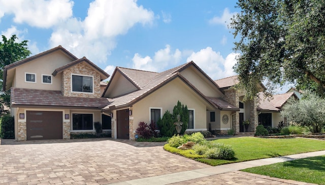 view of front facade featuring a front yard and a garage