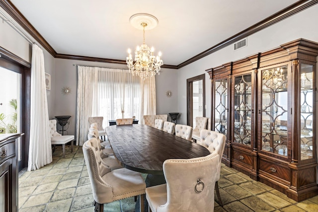 dining space with ornamental molding and an inviting chandelier