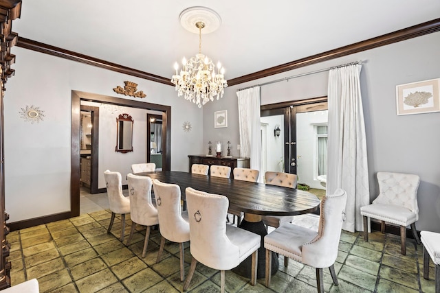 dining room with french doors, a notable chandelier, and ornamental molding