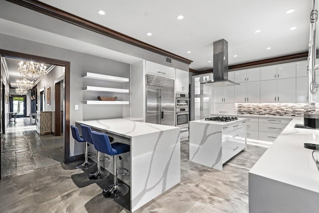 kitchen with a kitchen island, stainless steel appliances, backsplash, ventilation hood, and white cabinets