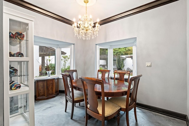 dining space featuring a wealth of natural light, ornamental molding, concrete flooring, and an inviting chandelier