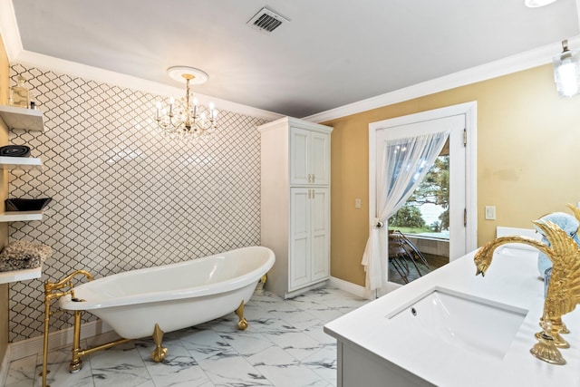 bathroom with vanity, crown molding, a bathtub, and an inviting chandelier