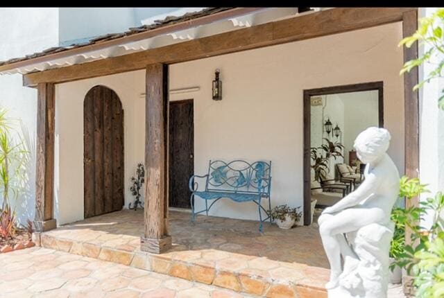 doorway to property with a patio