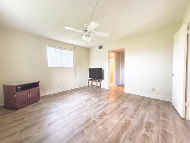 unfurnished living room with ceiling fan and light wood-type flooring