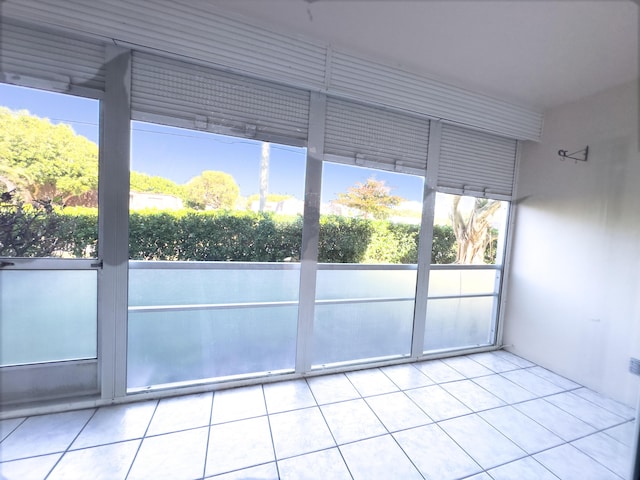 unfurnished sunroom featuring plenty of natural light